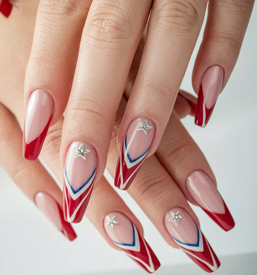 Easy & Cute July 4th Nails for 2025 Shiny Red Chevron Tips with Silver Stars