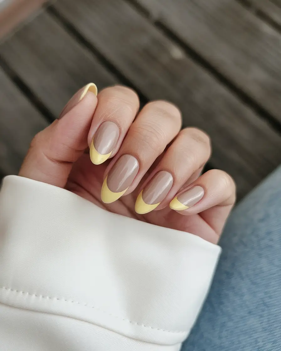 fall french tip nails designs almond Soft Yellow Crescent Tips for an Autumn Glow