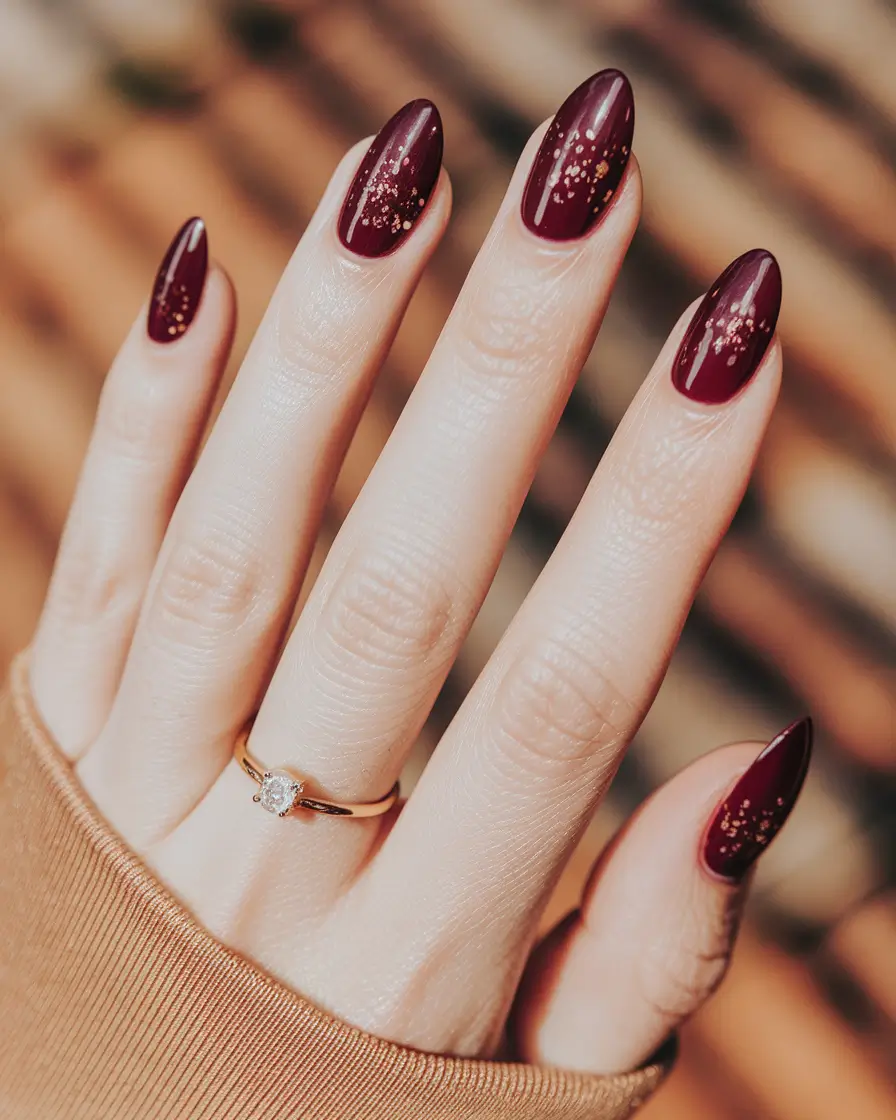 fall nail trends almond Wine Red Almond with Golden Flickers
