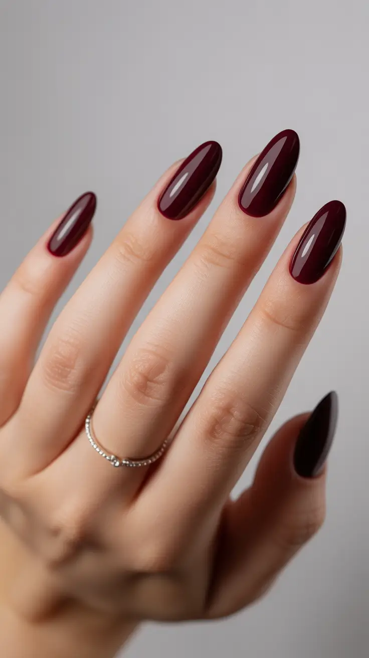 Trendy Winter Burgundy Nails Colors 2025–2026 - Garnet Almond Shine