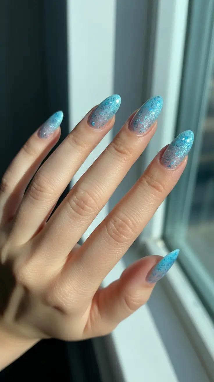 stylish gel nails 2026 - Icy Sky Blue Glitter Almond Gel Nails