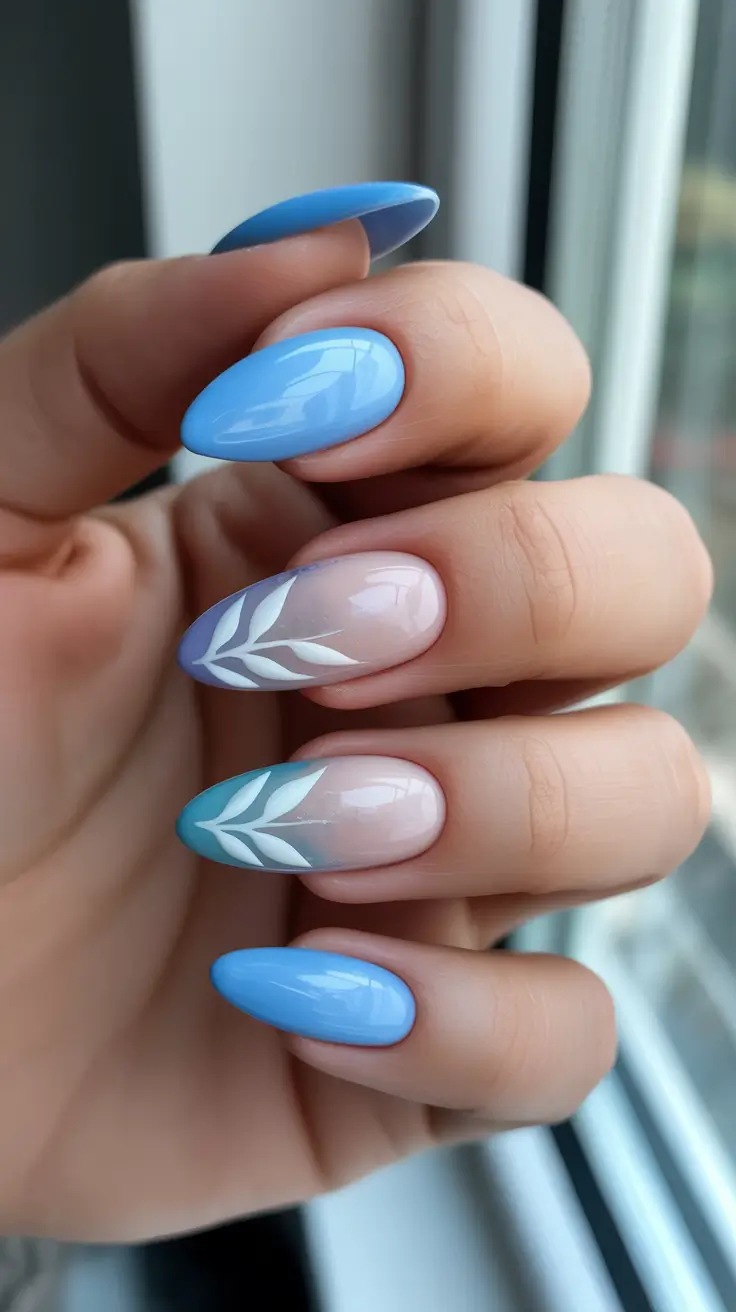 classy nails trend 2026 Sky Blue Gloss With Clean Leaf Accents